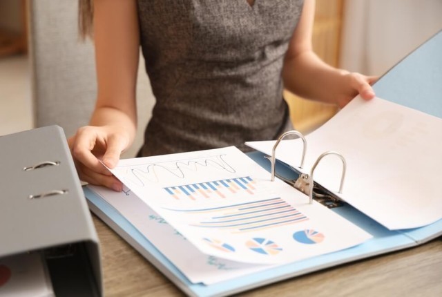 Businesswoman looking at finance documents