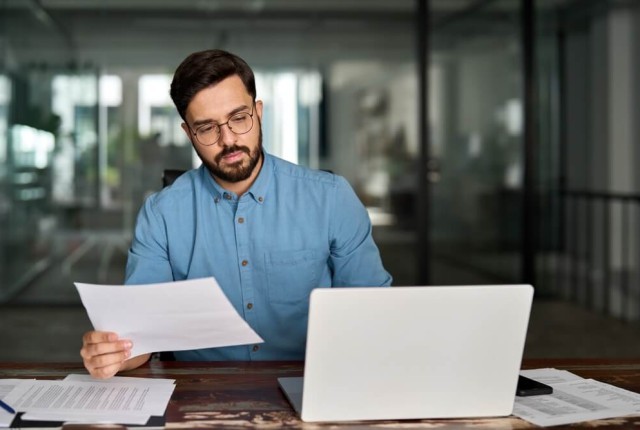Businessman looking at laptop