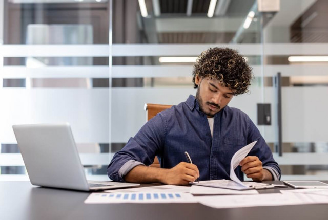 Man looking at business documents