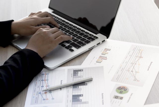 Businesswoman typing on the laptop