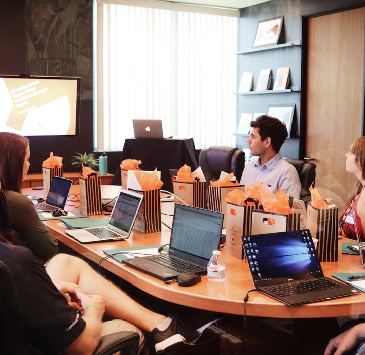 Team Members Sat In A Meeting